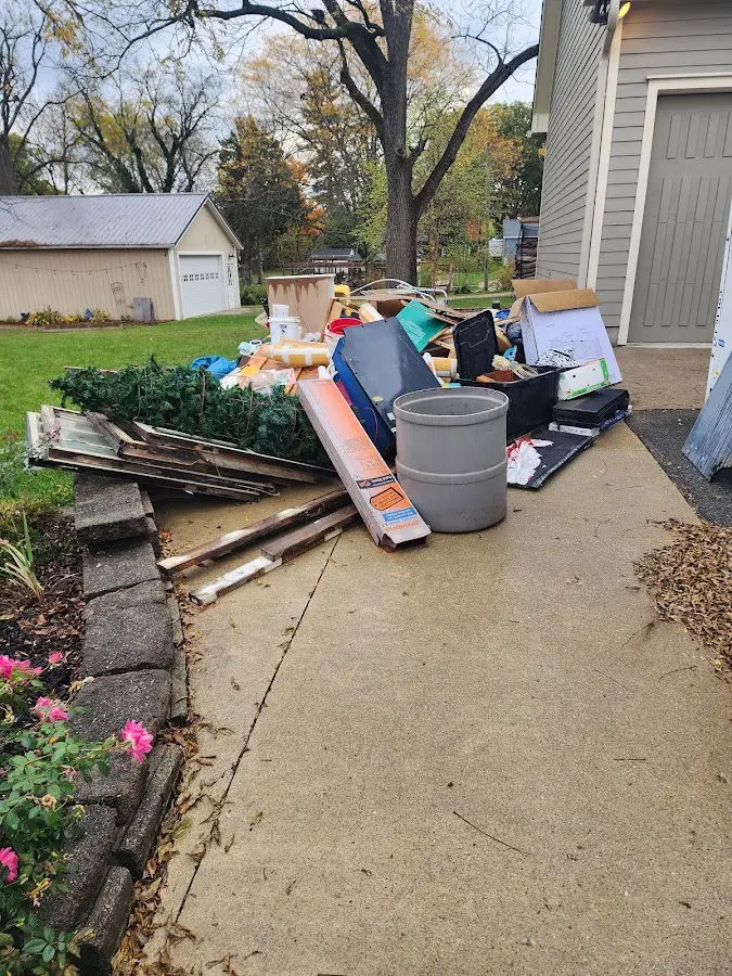 Dumpster being loaded with debris for Residential Dumpster Rental in Manassas Park